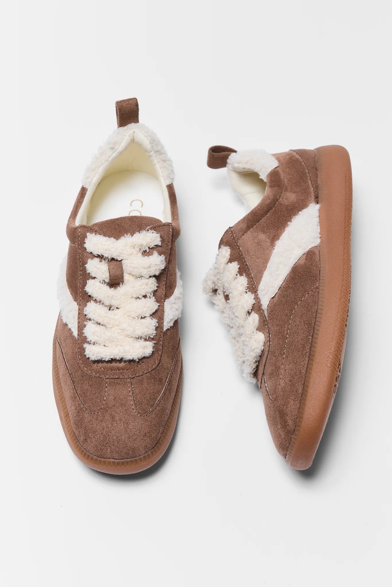 Brown sneakers with white fur lining on a light gray background Winona Brown Sherpa Sneakers