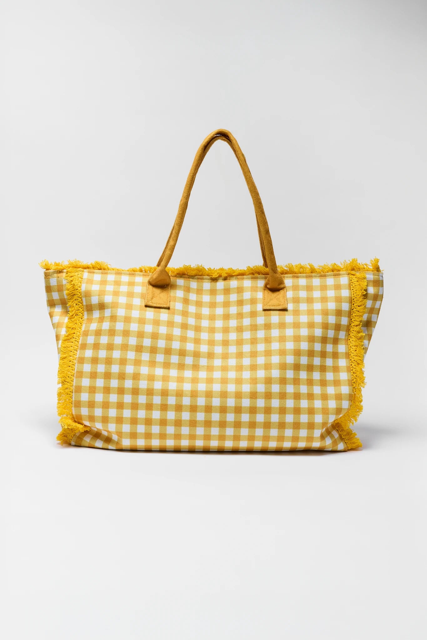 Yellow gingham tote bag with pom-pom details on a white background