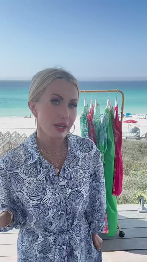 woman wearing Helen dress blue with beach in background