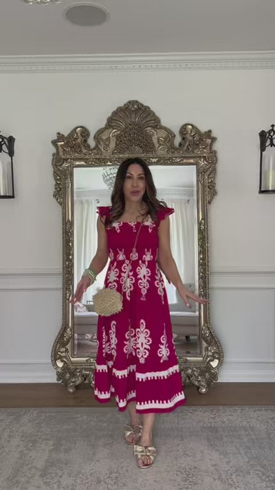 woman wearing tiffany pink maxi dress with mirror in background
