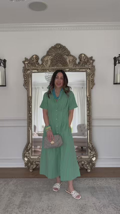 woman wearing olivia green maxi with mirror in background