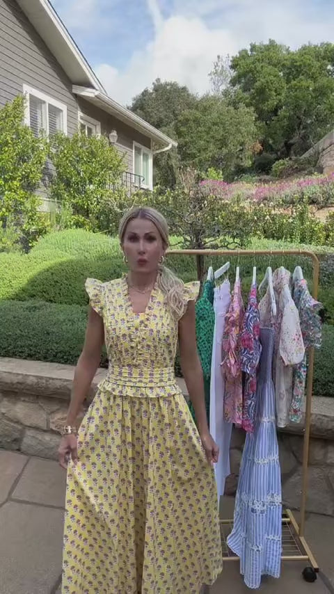 Woman in Magdalen Yellow Floral Maxi Dress outside 