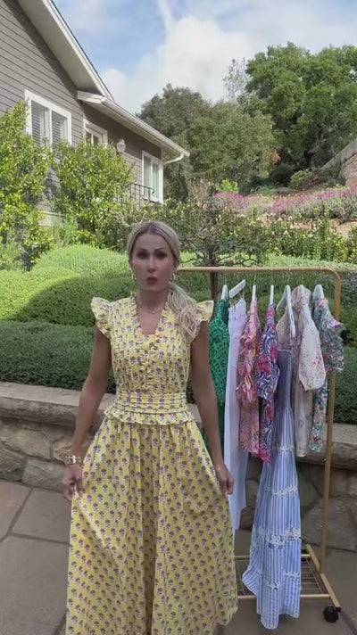 Woman in Magdalen Yellow Floral Maxi Dress outside 