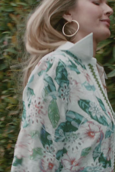 Avara Spring Collection video, women running through grass and flowers wearing colorful dresses and tops