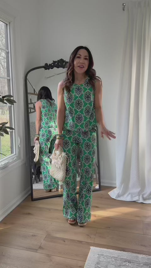 woman wearing matching green and blue goldie set with mirror in background