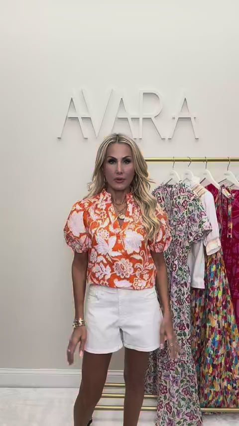 woman wearing rosanna orange top